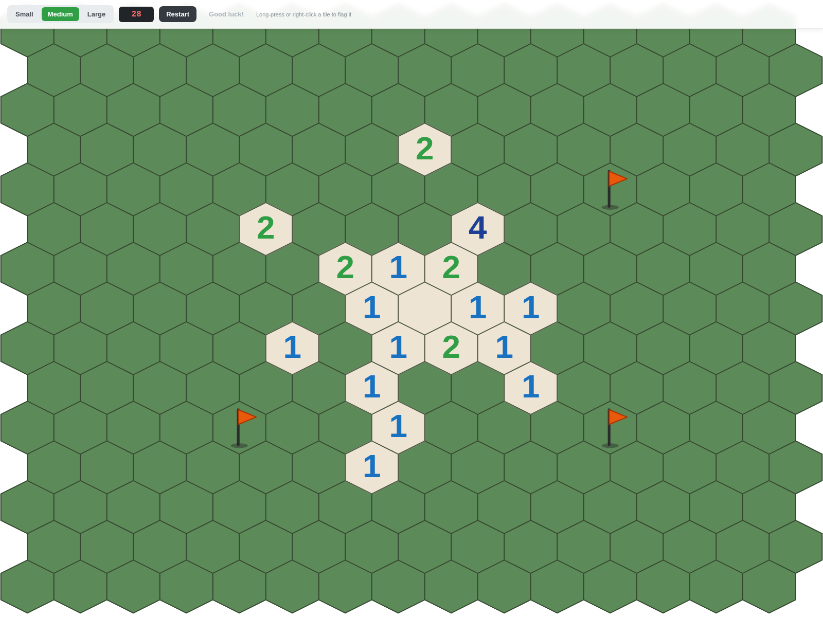 A hexagonal minesweeper board with a smaller uncovered pocket surrounded by three planted flags and a board-size picker in the toolbar.
